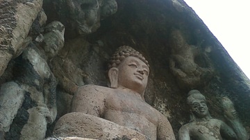 A rock cut image of the Buddha