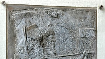 King Tiglath-pileser III holds a bow