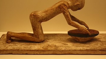 Egyptian Wooden Statue of a Woman Grinding Cereals