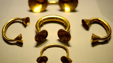 gold dress fastener Late Bronze Age Dress Fastener Monaghan This beautiful golden dress fastener was found near Clones in County Monaghan, and acquired by Trinity College Dublin in 1820 before it became part of