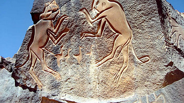 Saharan Rock Carving of Two Cats Fighting