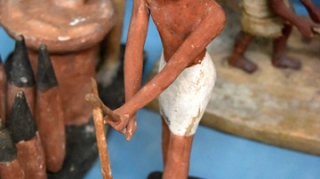 Egyptian Statuette of a Peasant Using a Hoe