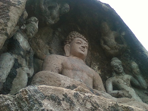 A rock cut image of the Buddha