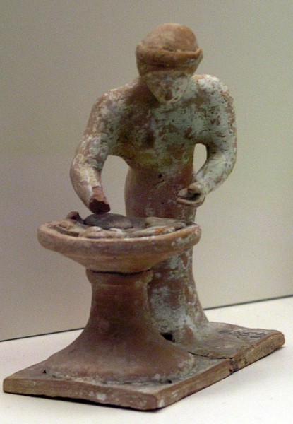 Terracotta Figurine of a Baking Woman