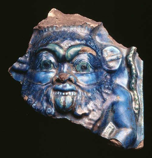 Bes, Blue Glazed Relief (by The Trustees of the British Museum, Copyright)
