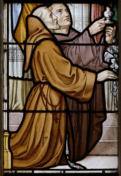 A Stained Glass Window Showing Two Franciscan Monks