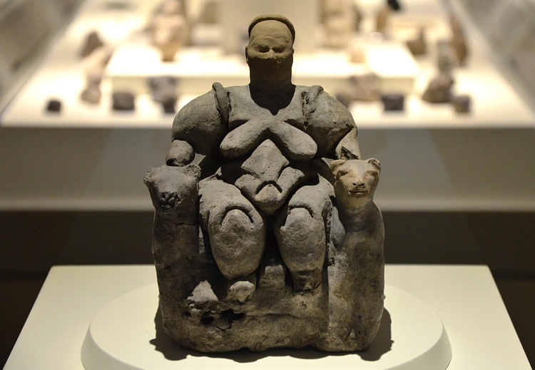 The statuette "Seated Woman of Çatalhöyük" is generally thought to depict a goddess (Museum of Anatolian Civilizations in Ankara, Turkey)