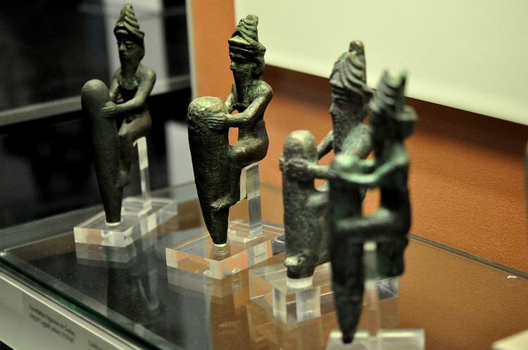 Copper alloy foundation figurines with pegs representing Gods