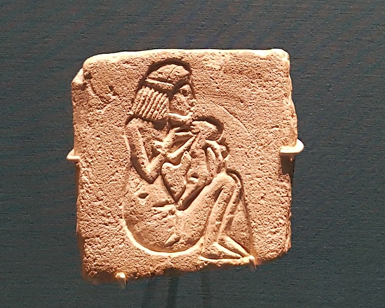 Egyptian Relief Of A Woman & Child