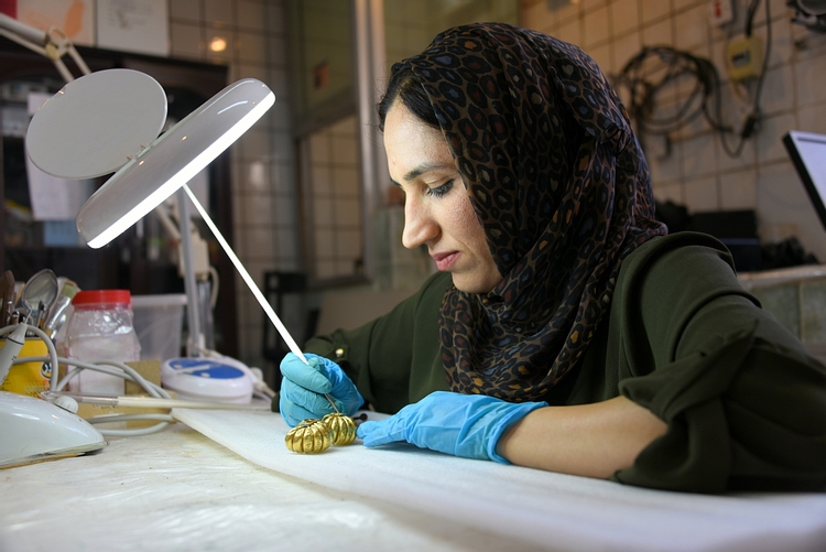 Curator with Pair of Gold Earrings from Ur III